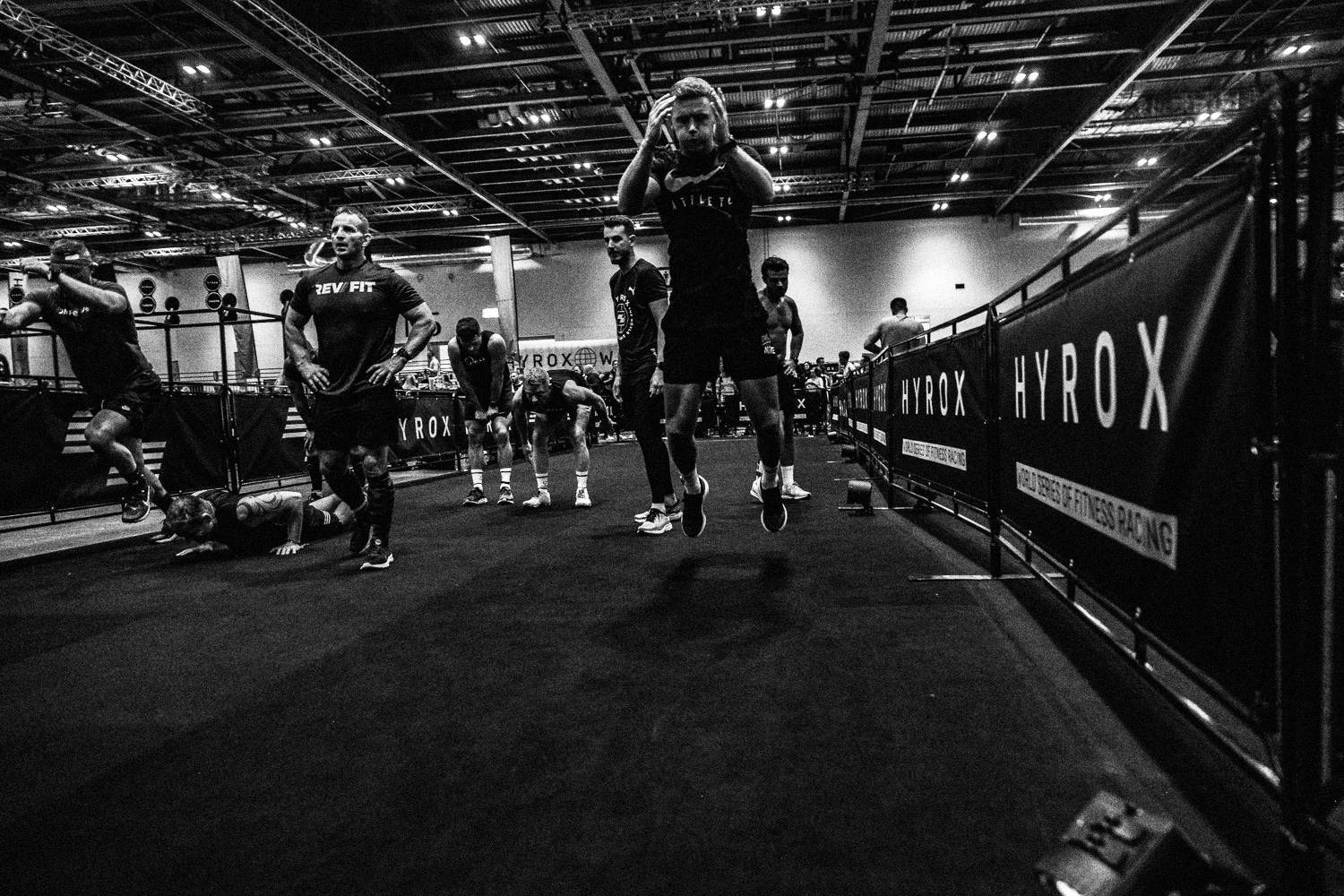 Athletes competing on the HYROX race floor